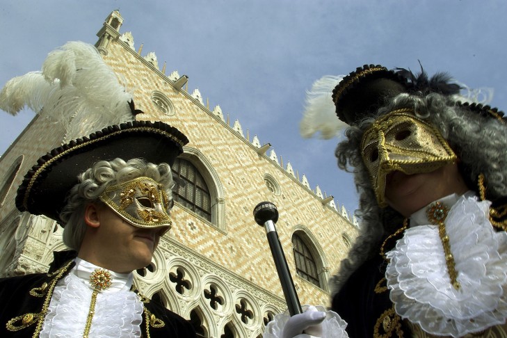 Masked revellers in Venice, Italy (Photo by Giuseppe Cacace/Getty Images)