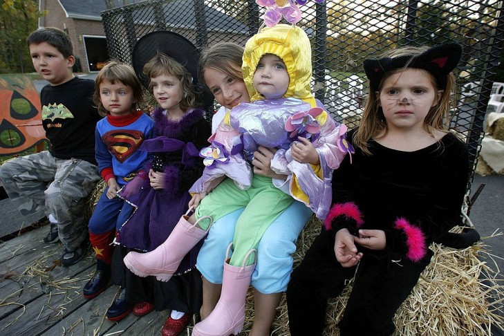 Young children dressed in various costumes get ready for a hay ride in Huntingtown, Maryland. (Photo by Mark Wilson/Getty Images)