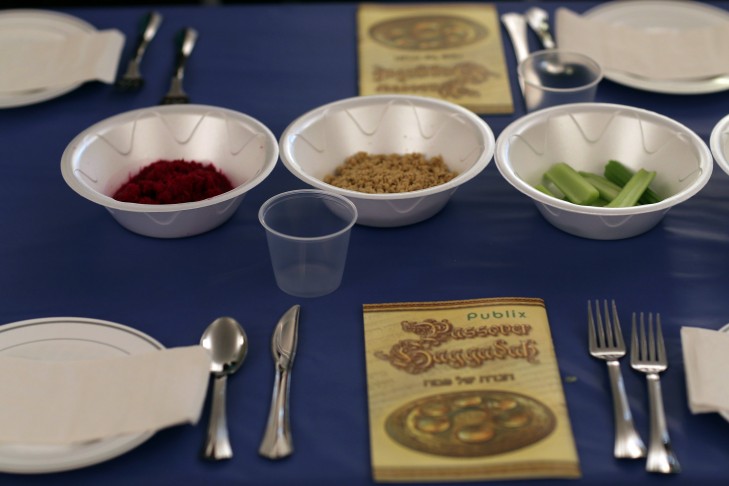 A table is set for a  community Passover Seder at Beth Israel synagogue in Miami Beach, Florida. (Photo by Joe Raedle/Getty Images)
