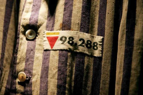 The prison uniform of Auschwitz survivor Leon Greenman is displayed in 2004 at the Jewish Museum in London, England. (IAN WALDIE/GETTY IMAGES)
