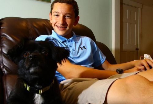 Max Davis at home in Stoneham with the family pet, Beau. (MARK LORENZ FOR THE BOSTON GLOBE)