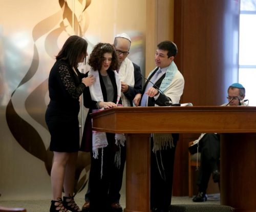 Zoe Spiegel was joined by her parents at her bat mitzvah at Temple Beth Shalom. (JONATHAN WIGGS /GLOBE STAFF)