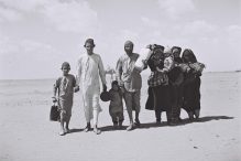 A YEMENITE FAMILY WALKING THROUGH THE DESERT TO A RECEPTION CAMP SET UP BY THE "JOINT" NEAR ADEN.