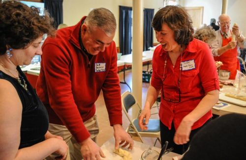 Bedford Police Chief Robert Bongiorno shaped his challah with the help of Rabbi Susan Abramson during a challah bread making lesson at the First Church of Christ in Bedford. Photo: James Jesson/File