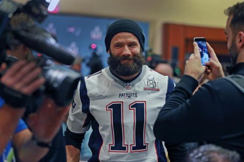 Patriots wide receiver Julian Edelman flashed a smile at a New England media availability in Houston. (JIM DAVIS/GLOBE STAFF)