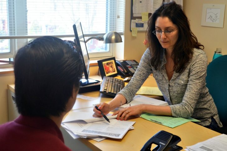 Immigration Legal Services supervising attorney Mariam Liberles working with a client. (Courtesy Catholic Charities)