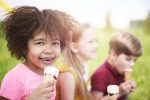 Kids eating ice cream iStock.com/gpointstudio