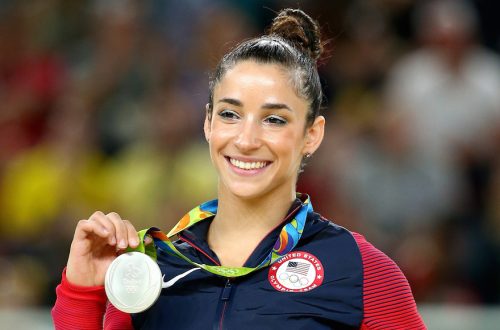 Aly Raisman celebrates on the podium after winning a silver medal at the Rio Olympic Arena, Aug. 16, 2016. (Alex Livesey/Getty Images)