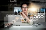 Woman on a computer working with technology (Photo: Cecilie_Arcurs/iStock)
