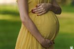 Pregnant woman holding bump (Photo: Jane-Khomi/iStock)