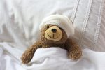 Teddy Bear in hospital bed with bandages (Photo: jojof/iStock)