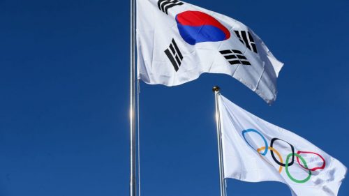 The national flag of Korea is pictured with the Olympic flag during the PyeongChang 2018 Olympic Village opening ceremony at the PyeongChang 2018 Olympic Village Plaza on Feb. 1, 2018, in Pyeongchang-gun, South Korea. (Getty Images)