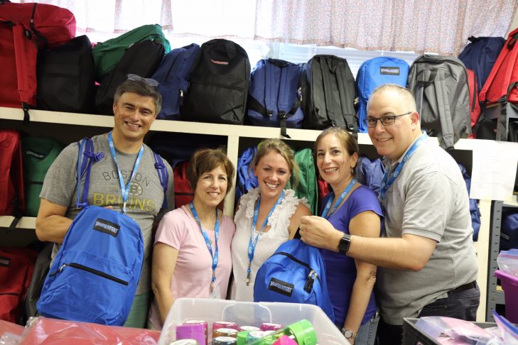 From left: Lino Covarrubias, Karin Blum, Sarah Abramson, Kimberlee Schumacher and Jeremy Burton with backpacks full of supplies for asylum seekers. (Photo: Craig Byer/CJP)