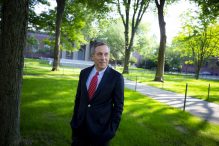 The 29th Harvard University president, Larry Bacow, walks through Harvard Yard on his first day in office. (Rose Lincoln/Harvard Staff Photographer)