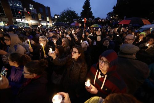 REFERRAL: People hold candles as they gather for a vigil in the aftermath of a deadly shooting at the Tree of Life Congregation, in the Squirrel Hill neighborhood of Pittsburgh, Saturday, Oct. 27, 2018. (AP Photo/Matt Rourke)