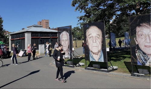 The Boston installation of 'Lest We Forget,' a Holocaust remembrance project centered on survivor photographs taken by Luigi Toscano, October 16, 2018 (Matt Lebovic/The Times of Israel)