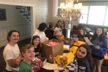 Ava and her friends join to make backpack kits (Courtesy photo)