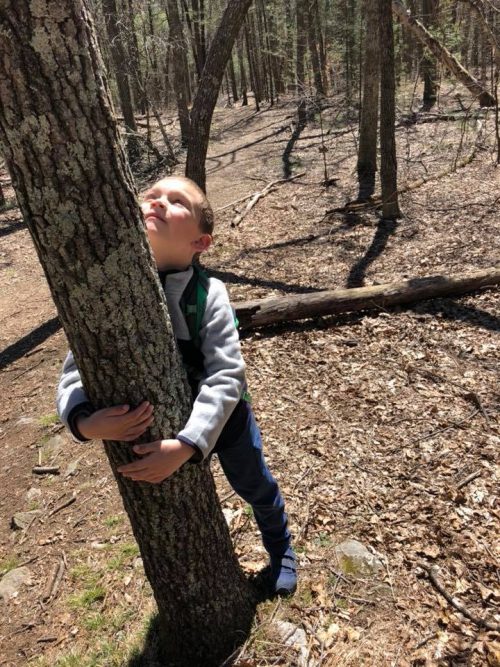 Elijah hugging tree