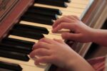 Child playing piano keys (Photo: Scott Catron/Flickr)