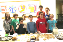 Students at Kesher Newton hosting a bake sale for JF&CS Family Table (Courtesy photo)
