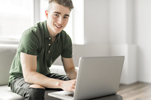 Teen boy with laptop computer internet, online (Photo: LSOphoto/iStock)