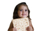 kid with matzah passover (Photo: hameleonseye/iStock)
