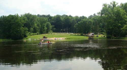 Eisner Camp in Massachusetts, a view of its lake seen here, is among 16 Reform movement overnight camps that will not open this summer. (Wikimedia Commons)