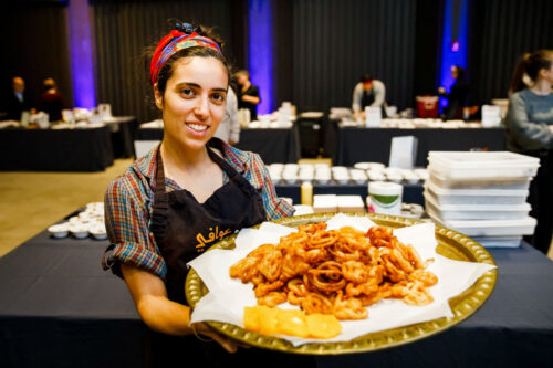 Annabel Rabiyah of the The Awafi Kitchen with a tray of Zangula at Beyond Bubbes Kitchen Annabel Rabiyah (Courtesy photo: Nir Landau Photography)