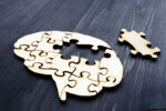 Brain puzzle, dementia or parkinson's concept Brain from wooden puzzles. Mental Health and problems with memory.