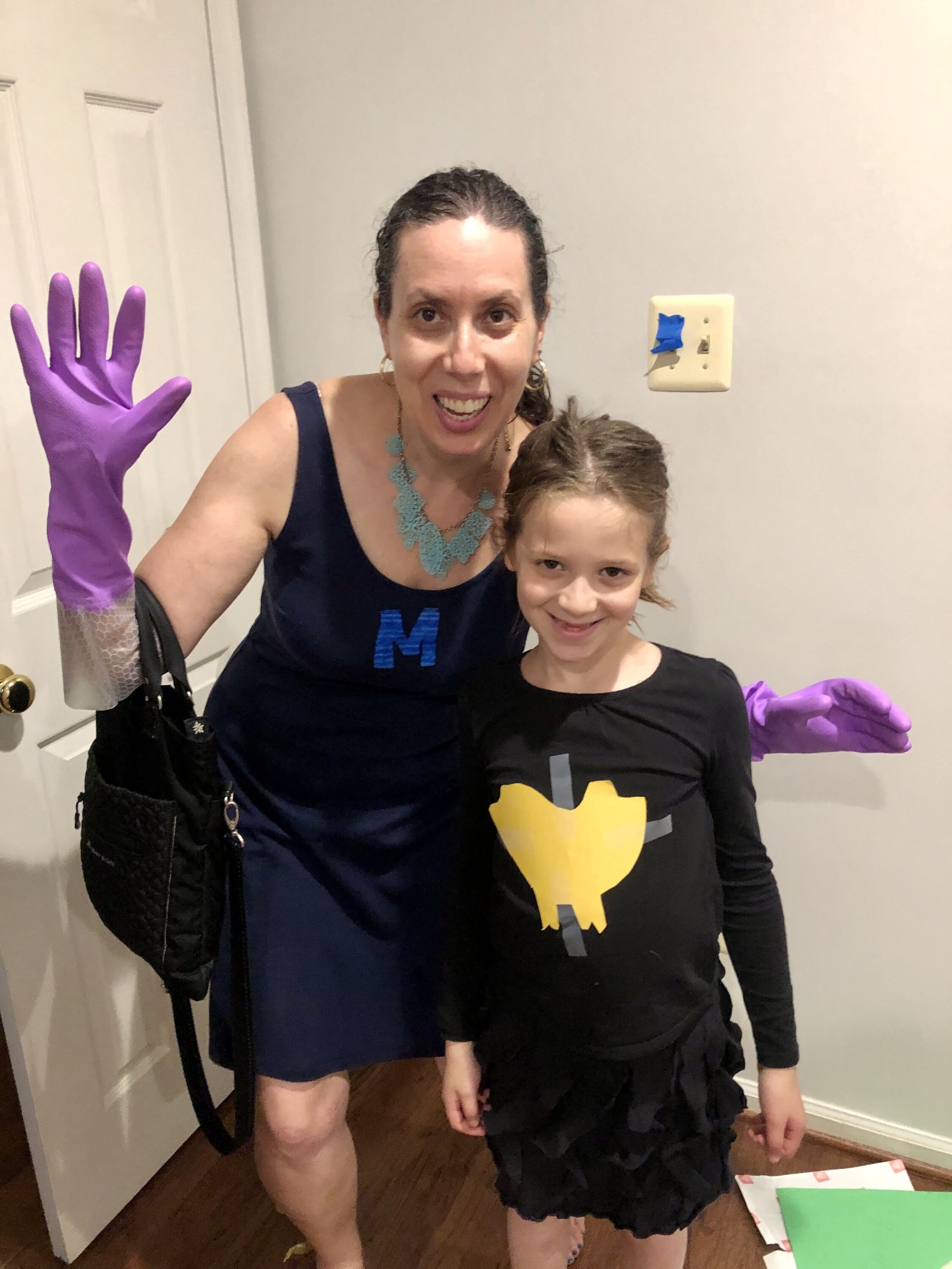 Sarah Feinberg and her daughter, Gali, dressed as Super Mom and Batgirl for “Superhero Shabbat” at home (Courtesy photo)