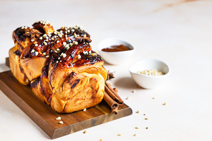 Swirl brioche with apricot jam, nuts, cinnamon and anise star. Braided or roll bread, Babka.