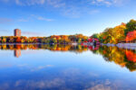 Jamaica Pond Autumn foliage along Jamaica Pond in Boston's Jamaica Plain neighborhood. Boston is the largest city in New England, the capital of the state of Massachusetts. Boston is known for its central role in American history,world-class educational institutions, cultural facilities, and champion sports franchises.