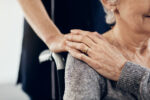 Cropped shot of a female caregiver comforting a senior woman