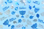 Happy Chanukah decorations on a blue background
