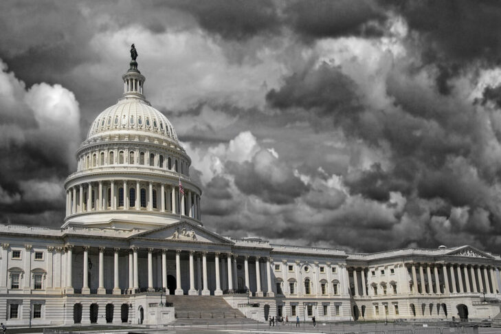 The United States Capitol in Washington DC with dark storm clouds