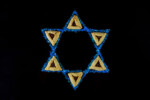 Jewish holiday background with hamantaschen cookies and star of David for Purim.