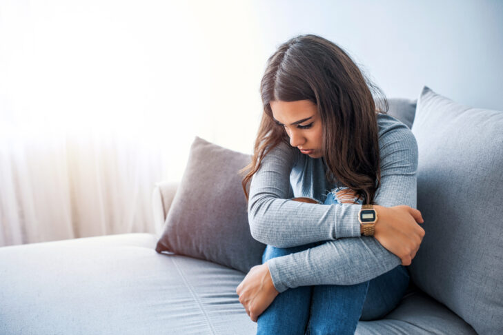 teen girl at home sad depressed mental health