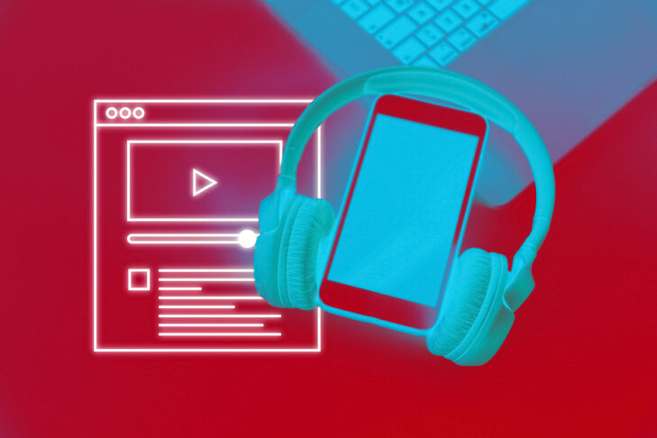 Smart phone and laptop with earphones on red background