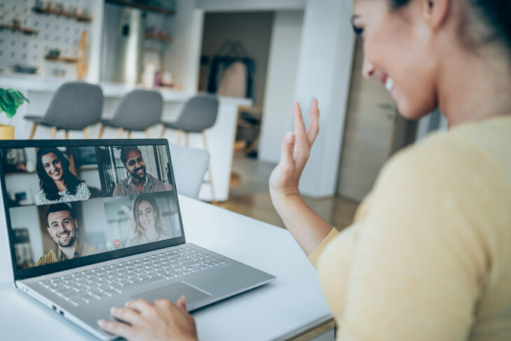 Young businesswoman talking to her colleagues about business plan in video conference. Multi-ethnic business team using laptop for a online meeting in video call. Creative business person working at home. Female freelancer having important online conversation with customers. Shot of young white woman using a laptop for web conference.