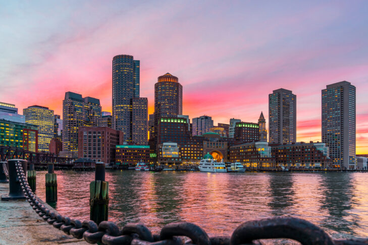 Boston skyline and Fort Point Channel at sunset as viewed fantastic twilight or dusk time from Fan Pier Park in Boston, Massachusetts, USA. United state downtown beautiful colorful skyline.