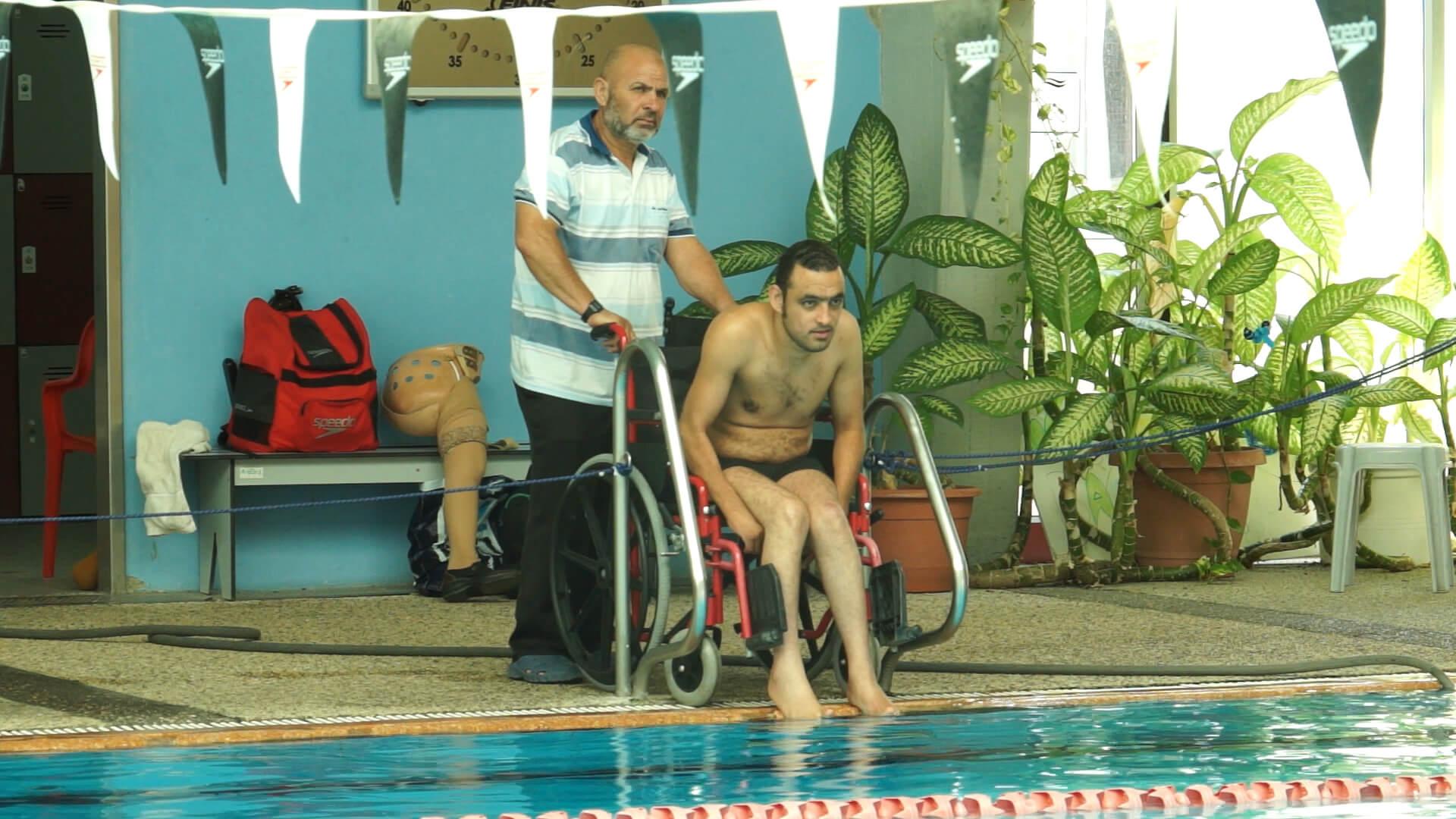 Iyad Shalabi and his father, Yusef, in the documentary “Swimming Against the Current” (Promotional still)
