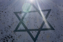 Symbol of Judaism or Star of David. Six-pointed star in a centre of composition in beams of the sun.