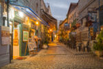 Safed, Israel - November 17, 2015: Sunset scene in an ally in the Jewish quarter, with local businesses, in Safed (Tzfat), Israel