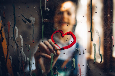 Painting a heart A female artist in her studio