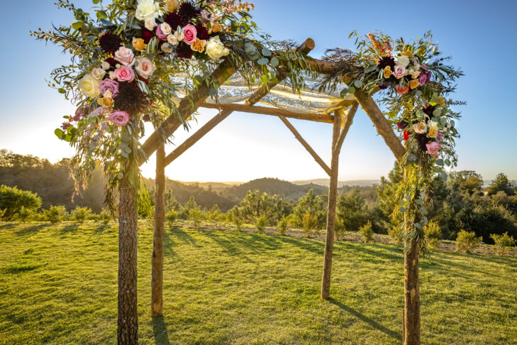 Outdoor sunset view of a Jewish traditions wedding ceremony. Wedding canopy chuppah or huppah .