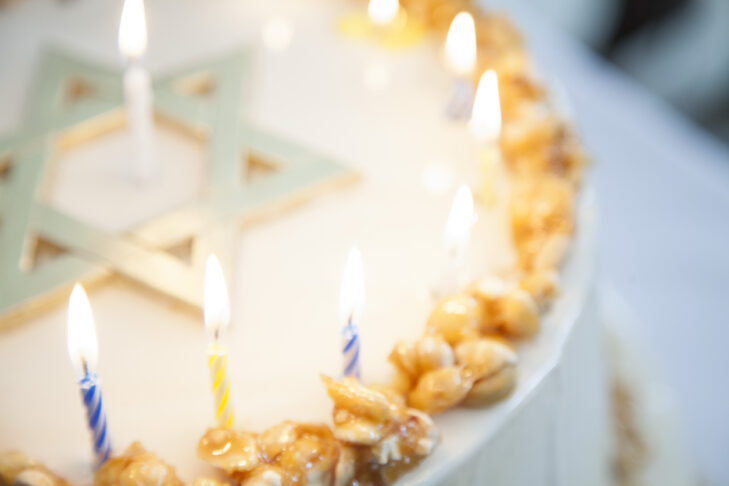 B'nei Mitzvah cake with candles.