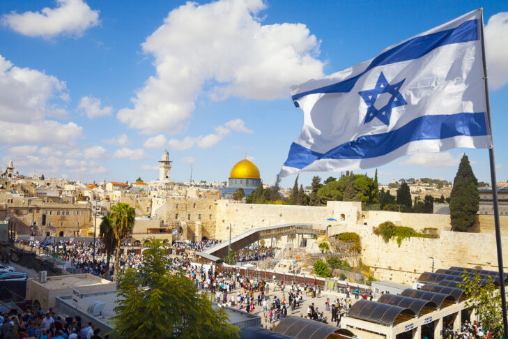 Israel flag with a view of old city Jerusalem and the KOTEL- Western wall