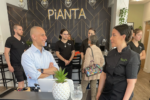 Providence Mayor Jorge Elorza speaks with PiANTA owner and executive chef Michelle Politano at the restaurant’s ribbon cutting on Thursday, April 12, 2022. JULIET PENNINGTON