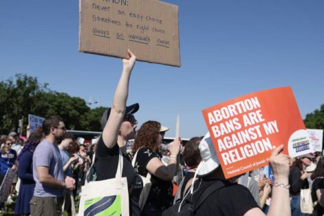 A protester carries a sign as they attend the "Jewish Rally for Abortion Justice" rally at Union Square near the U.S. Capitol on May 17. Anna Moneymaker / Getty Images