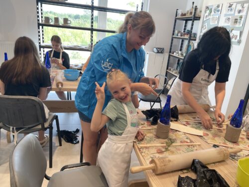 A moment of joy during a ceramics class at the JDC “hotel” in Poland for Ukrainian refugees (Photo: CJP)